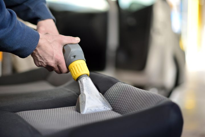 auto car service cleaning the drivers seat, cleaning